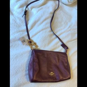 Crossbody coach purse, with wristlet attachment.